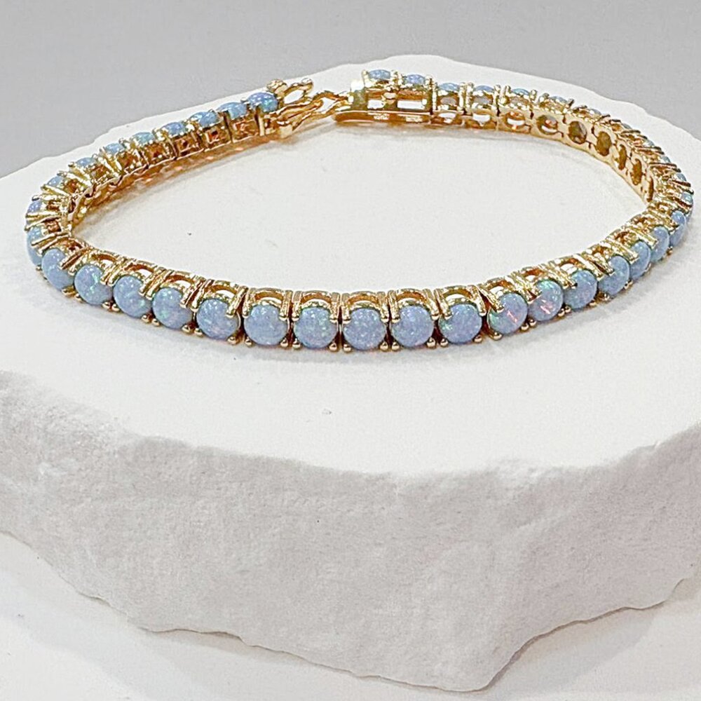 Shimmering Simulated Blue Opal 18K gold plated tennis bracelet